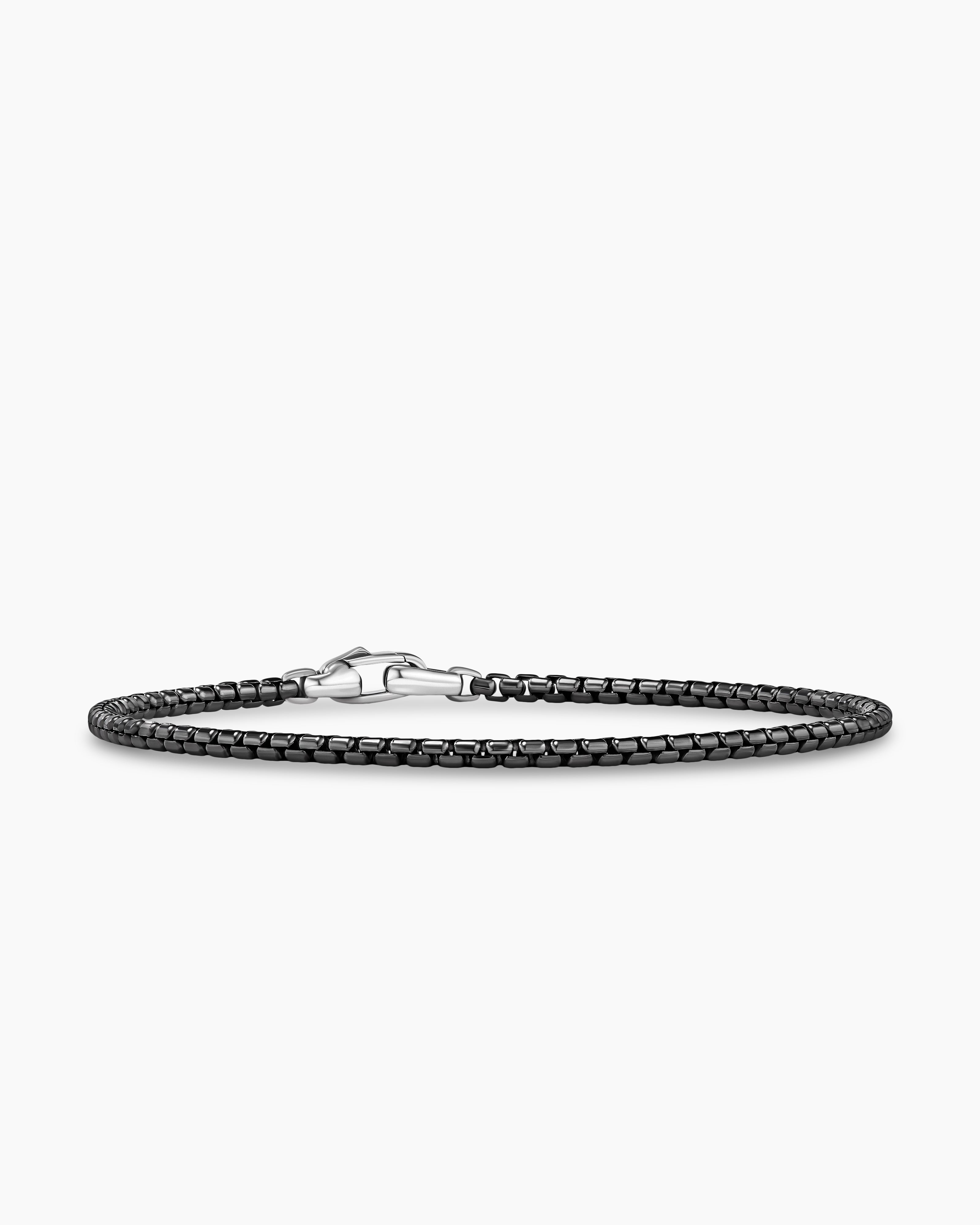 Bracelet in woven black leather with steel closure, black PVD